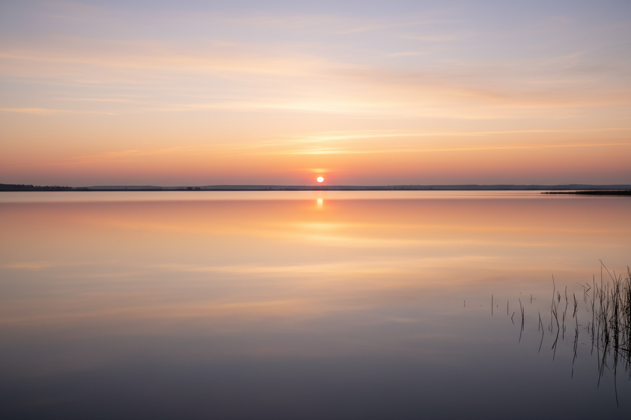 Peaceful sunrise with water reflections